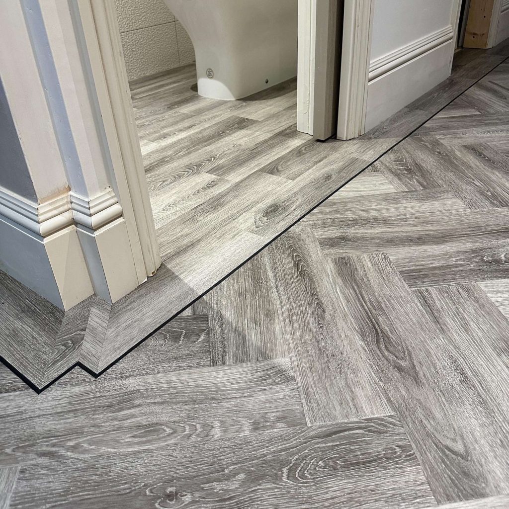 Grey landing and btthroom flooring